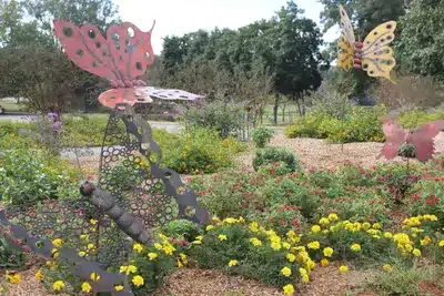 In-ground garden with iron butterflies